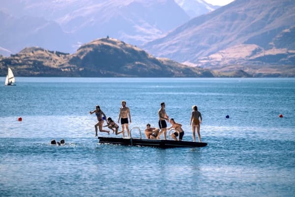 People swimming and enjoying the water at Lake Dunstan