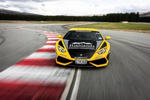Supercar on the Highlands circuit cornering at speed